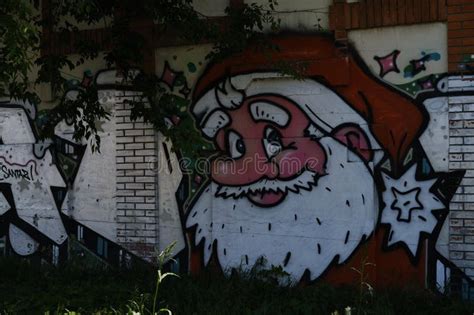 Graffiti Depicting Santa Claus with a White Beard in a Red Suit on the ...