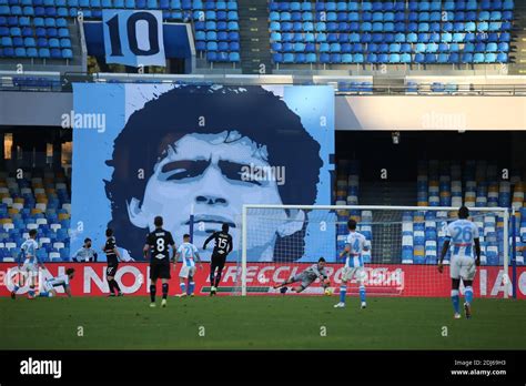 Naples, Italy. 13th Dec, 2020. A giant banner depicting Diego Armando ...