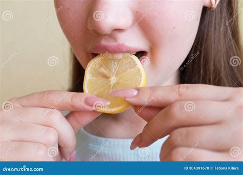 Young Beautiful Girl Eating Lemon, Close-up, Crop Photo. Mouth Eating a ...