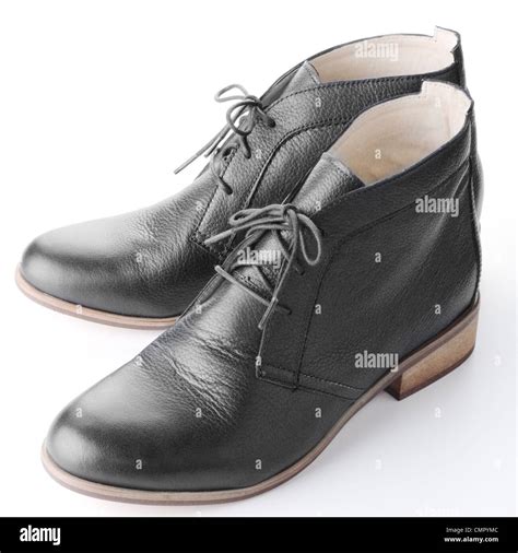 Pair of black women's shoes over white background Stock Photo - Alamy