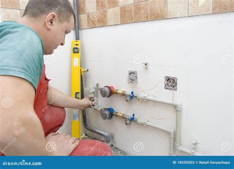 Drilling Holes for the Fixing Water Pipes Stock Image - Image of ...