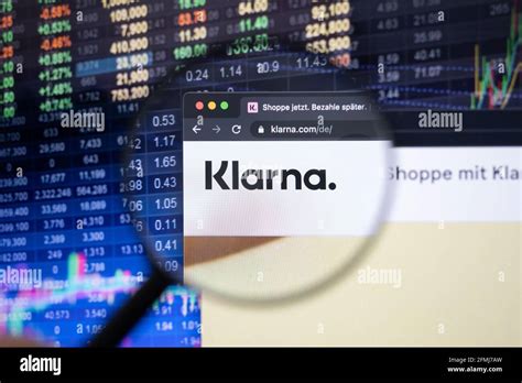 Klarna company logo on a website with blurry stock market developments ...