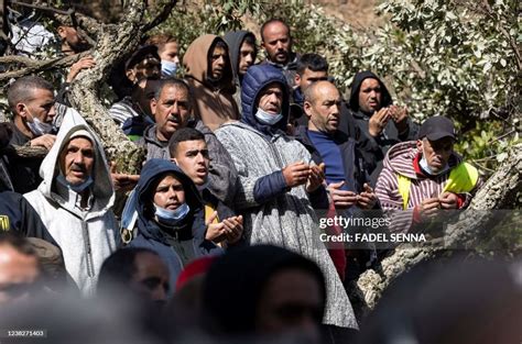 Moroccans pray during the funeral of five-year-old Rayan Oram in the ...