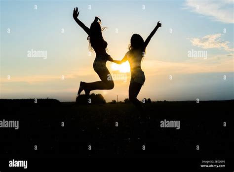 Two people silhouette excited hi-res stock photography and images - Alamy