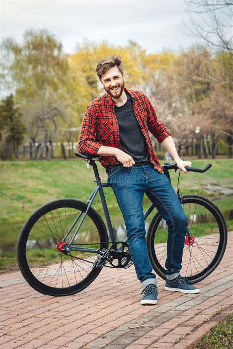 Handsome Young Man with Bicycle Stock Image - Image of holidays, green ...