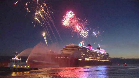 Disney Fantasy cruise ship arrives at Port Canaveral, Florida with fireworks and characters