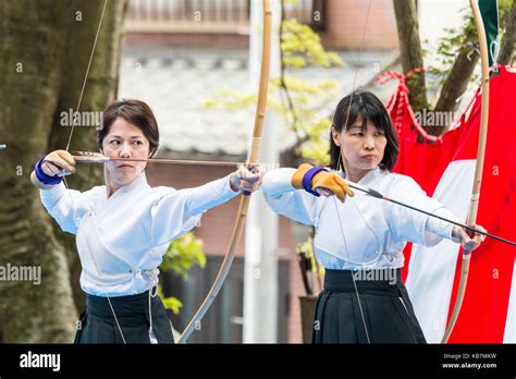 Japan, Osaka, Tada. Genjo parade and festival. Archery contest, two ...