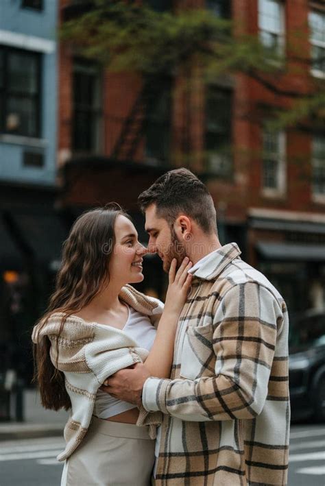 A Romantic Couple is Embracing and Smiling in a Closeup Moment of Love ...