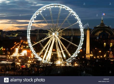 Ferris wheel and the city of Paris at night time Stock Photo - Alamy
