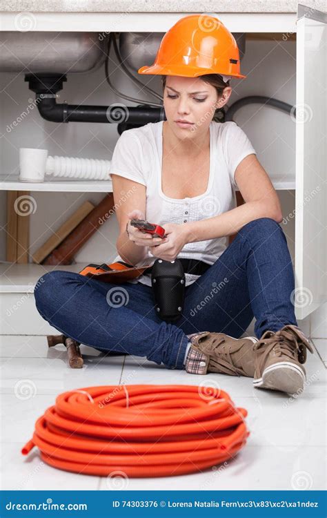 Plumber Woman Sitting Holding a Wrench Stock Photo - Image of ...