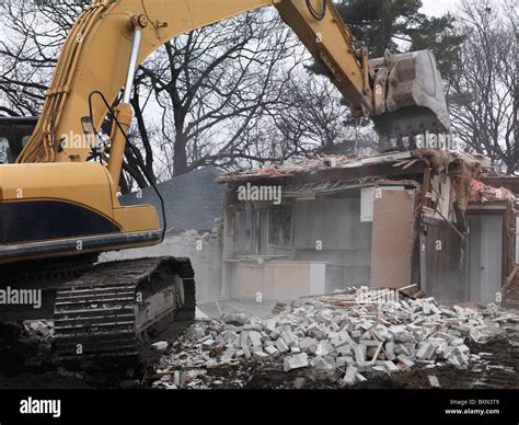 Excavator demolishing a house. Toronto, Canada Stock Photo - Alamy