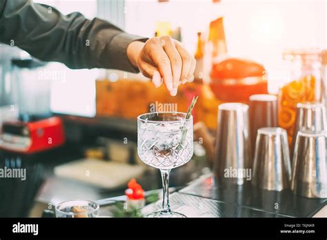 Bartender mixing cocktail outdoors bar hi-res stock photography and ...