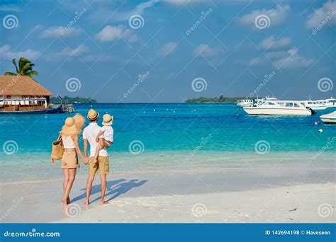 Family with Three Year Old Boy on Beach Stock Photo - Image of polo ...