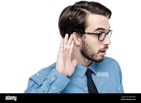 Businessman carefully listening to conversation Stock Photo - Alamy