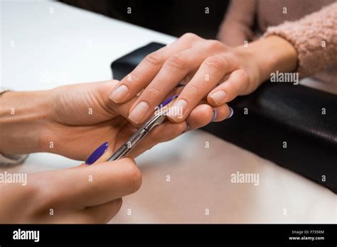 Manicure master removing nail hi-res stock photography and images - Alamy