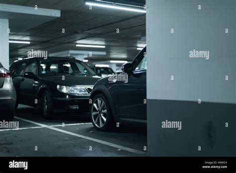 Cars parked in parking garage Stock Photo - Alamy