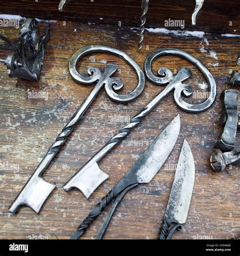 Forged keys and knives are on the counter for sale Stock Photo - Alamy