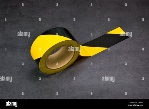 Danger zone floor marking sticker tape coil on the cement floor ...