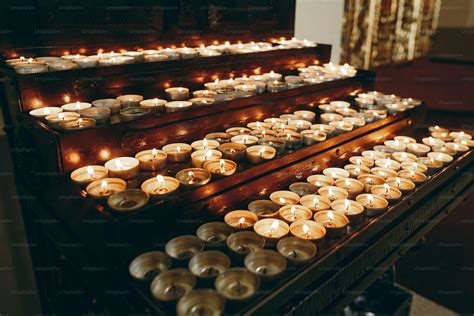 Burning candles on altar close-up in church, lighting candle, mourning ...