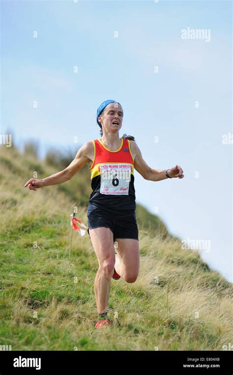 Female fell runner in a race Stock Photo - Alamy