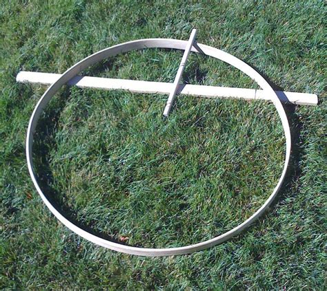 A wooden hoop and a stick to roll for outdoor play
