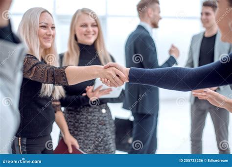 Young Business Colleagues Confidently Shaking Hands.business Concept ...