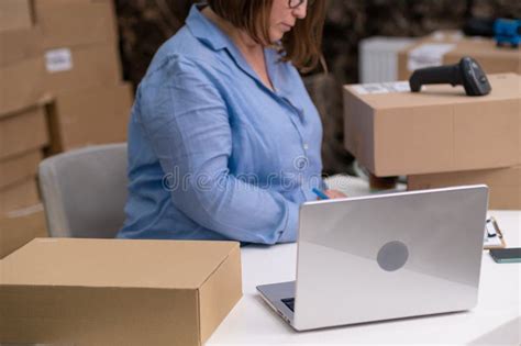 Business E-commerce, Online Store Warehouse Working on Laptop Managing ...