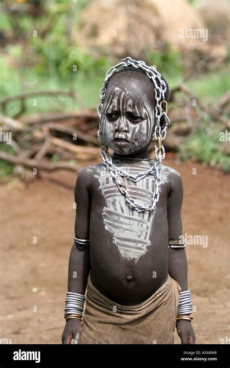 Mursi tribe boy wearing a link chain as jewelry, Lower Omo Valley Stock ...