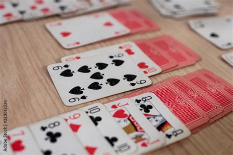 French playing cards stacked together in a solitaire. Solitaire game ...