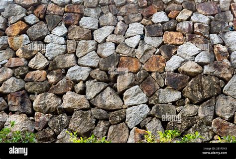 Natural stone masonry wall texture or background Stock Photo - Alamy