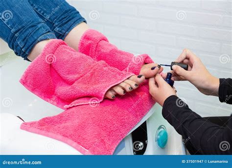 Pedicure Chair Spa and Woman Hands Painting Toes Nail Polish Stock ...