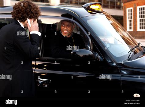 Passenger communicating with taxi driver Stock Photo - Alamy