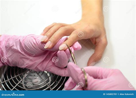 Manicure. Closeup of Manicurist Hands Removing Cuticle from Female ...