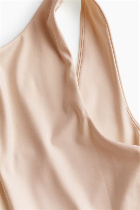 Low-back Thong Bodysuit - Light beige - Ladies | H&M US