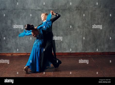 Ballroom dancing. Young couple ballroom dancers. Studio shot Stock ...