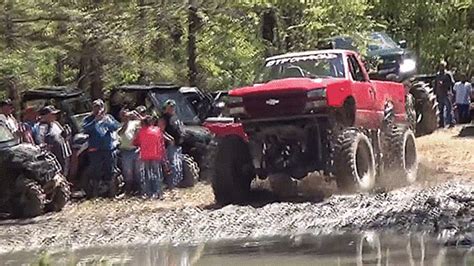 Watch These Monster Mud Trucks Get Stuck In The Impossible Pit From Hell