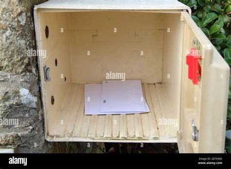 Open mailbox with mails in it Stock Photo - Alamy