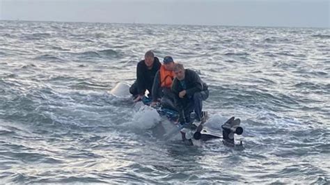 Coast Guard Rescues Three Men Clinging To Capsized Boat | iHeart