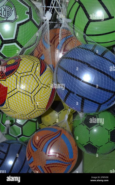 Colorfull plastic balls hanging on the display rack Stock Photo - Alamy