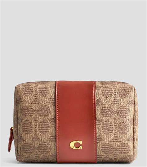 COACH: Cosmetiquera con monogram Mujer | El Palacio de Hierro