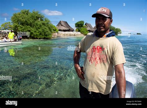 Micronesian man rides a boat in the lagoon of Pohnpei, Federated States ...