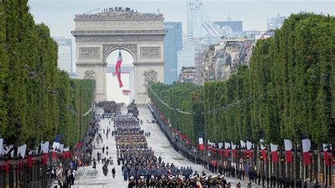 France celebrates national day with traditional military parade