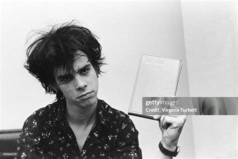 Nick Cave, lead singer of the Birthday Party, portrait holding a ...