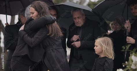 Funeral, crying family and people hug for grief support, mourning ...
