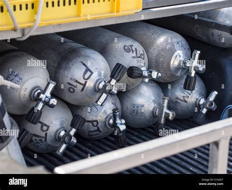 Scuba Diving Tanks. Eight air tanks stacked and ready for transport to ...