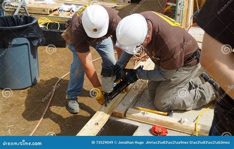Two Men Nailing Wood Strips Editorial Stock Image - Image of join ...