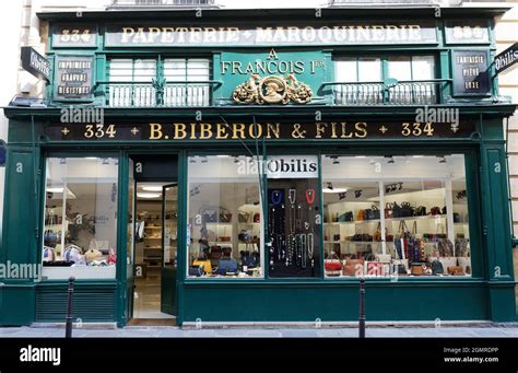The vintage facade of ancient boutique located at Saint Honore street ...