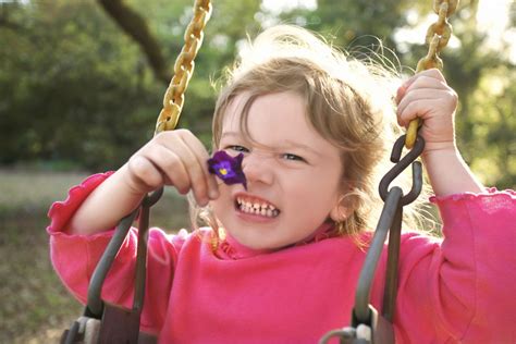 Girl holding a flower and swinging Free Stock Photo | FreeImages