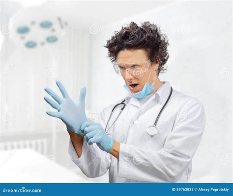 Funny Doctor is Putting on Gloves Stock Photo - Image of portrait ...