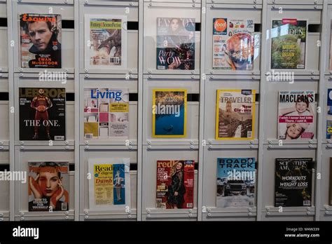 magazine display on wall Stock Photo - Alamy
